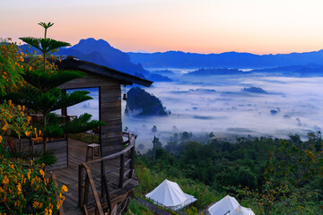 Sunrise and morning mist at Pha Chang Noi Viewpoint, Phu Langka National Park, Phayao Province, Thailand.