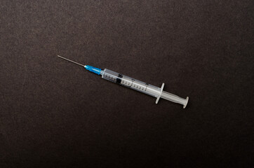 Medical plastic syringe for injection and vaccination on paper background