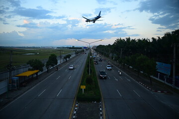 traffic jam in evening long exposture . blur car and air plane transportation