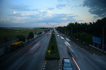 traffic jam in evening long exposture . blur car and air plane transportation