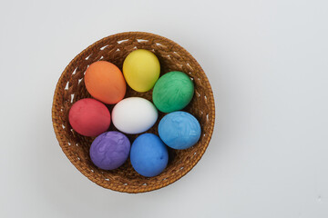 Easter Eggs in basketEaster colorful eggs in a basket on a white background