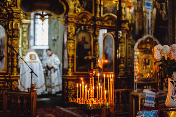 Church. Orthodox Church. Christianity. Church lighted candles. Icon. Religion. Film noise 