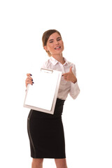 Young girl posing at camera with blank tablet in hands. Girl in office clothes stands with an empty tablet in her hands.