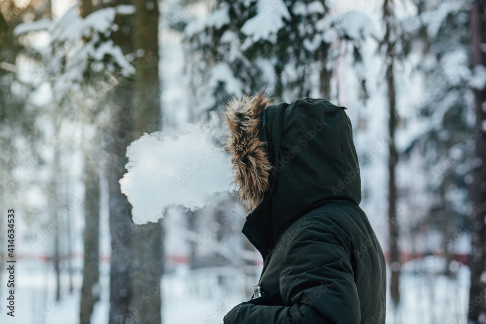 Wall mural young man smoking electronic cigarette