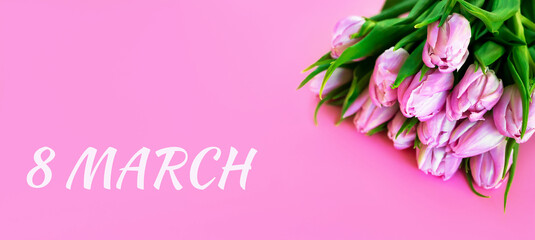 8 March text near a bunch of roses. Banner. Women's day. Spring