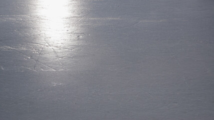 Ice skating rink, polished ice, glare of light on the ice