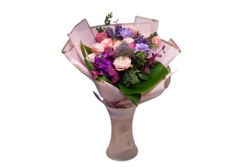 Bouquet of  soft pink flowers in pink wrapping paper.