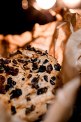 Homemade bread with chorizo, dried tomatoes and black olives