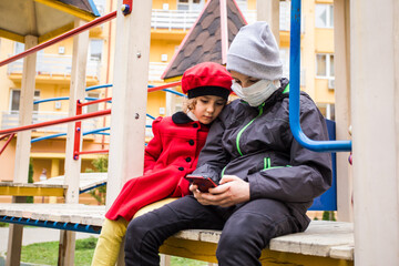 Fototapeta na wymiar Kids choosing gadgets instead of active games