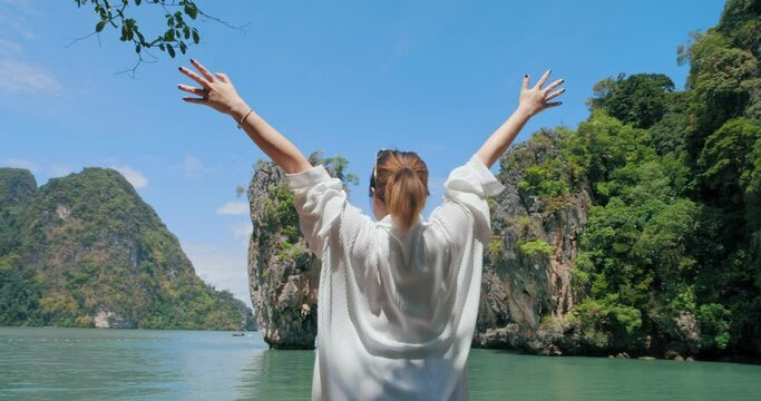 Asian traveler with relaxing on amazing nature sea beach joy view James Bond island, Phuket, travel Thailand, Beautiful destination landscape Asia, Summer holiday outdoor vacation trip