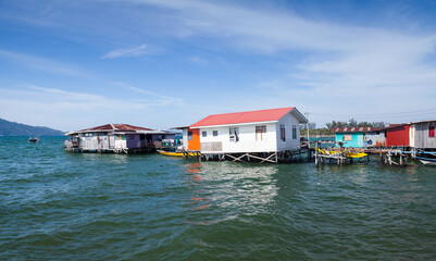 Fototapeta premium Malaysia, wooden rickety houses and footbridges on stilts