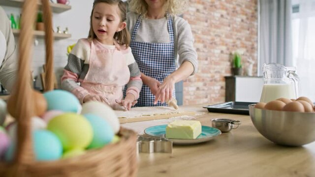 Video of little girl making Easter cookies with family. Shot with RED helium camera in 8K.