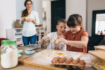 kids baking with their mother at home
