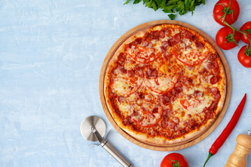 Delicious pizza with sausages on gray background