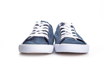 blue sneakers on white background with copy space. Youth shoes.
