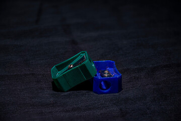 Picture of two pencil sharpener on black background isolated.