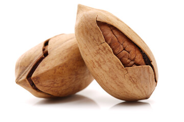 Peeled pecan nuts closeup, isolated on white background