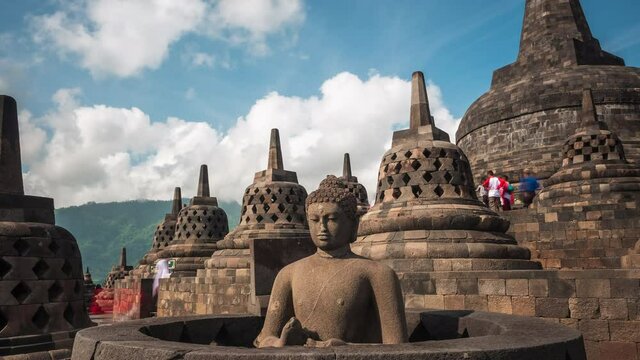 Zoom out time lapse view of the ancient ruins of Borobudur, a 9th-century Mahayana Buddhist temple in Magelang Regency near Yogyakarta in Central Java, Indonesia.