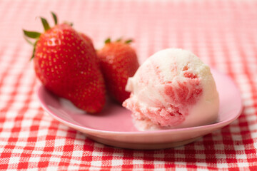 Vanilla ice cream with variegato fruit and fresh strawberries