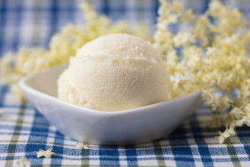 Elderflower ice cream scoop with elderflower