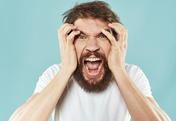 aggressive man yelling on blue background stress irritability emotions impulsive