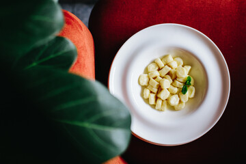 Italian gnocchi in a deep tarrel with white sauce