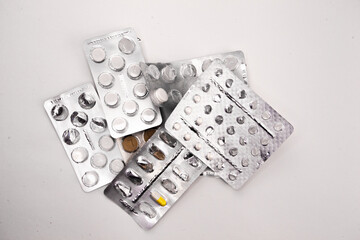 Medicine pills packed in blisters. close up of  pill package  on white background  with clipping path.