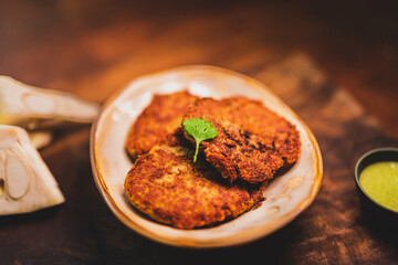Close up of crispy patties made with jackfruit also known as Kathal kebab in India. fried crispy veg patties at a restaurant table.