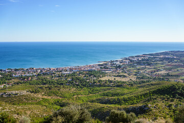 Fototapeta na wymiar Mediterranean coast in Spain, holiday area with lots of vegetation and calm sea