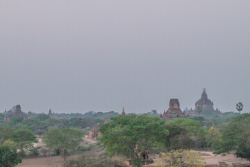 view of Pagodas and temples of Bagan, in Myanmar, formerly Burma, a world heritage site in amusty day during its sunrise