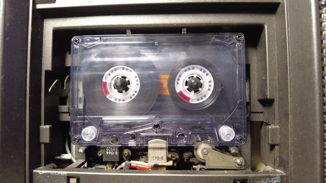 Close up audio cassette tape playing