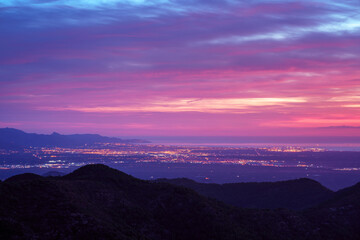 Colourful sunrise over the Spanish Mediterranean coast in La Plana Region. Dawn city light.