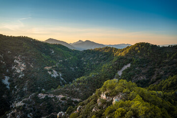 Mountainous landscape with pine tree and cork oak forests in the Sierra de Espadán Natural Park, Region of Valencia, Spain.