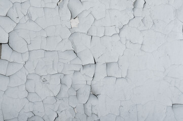 Background from old white walls, textured rough surface with small cracks, outdoor atmospheric exposure. Horizontal photography close-up