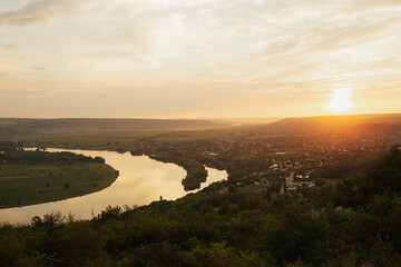 A panoramic sunset over the river from the hill.