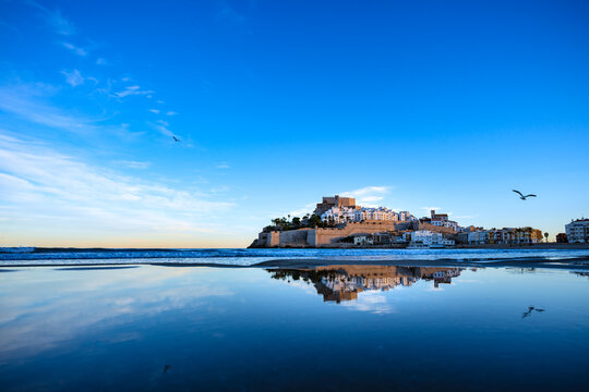 Beautiful village reflected on still water. Famous place Peniscola or Pe&ntilde;iscola on the Mediterranean. Templar Castle.