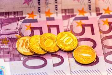 Russian ruble coins on 500 euro banknotes