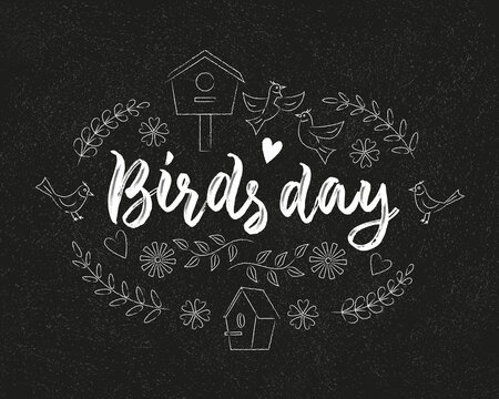 Birds day lettering composition decorated with bird, flowers, birdhouse and heart. Vector black and white illustration. Chalk effect on blackboard.