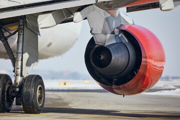 Hot air behind jet engine of plane at airport. Commercial airplane taxiing to runway before take off. 