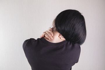 close-up on a woman's hand massaging her neck. Girl's neck hurts