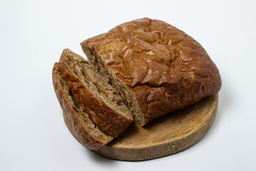 Sliced black bread on a white plate. Borodino bread. Homemade baking. Bakery product