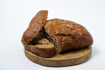 Sliced black bread on a white plate. Borodino bread. Homemade baking. Bakery product