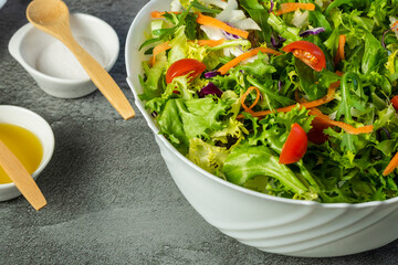 Fresh green salad with tomatoes and vegetable