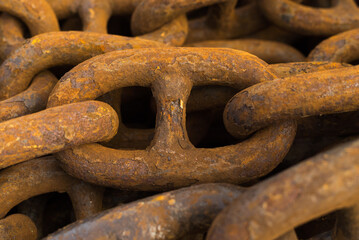 Large iron anchor chain. A rusty chain link. Corrosion. Shackles.