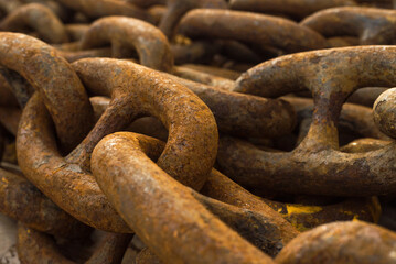 Large iron anchor chain. A rusty chain link. Corrosion. Shackles.