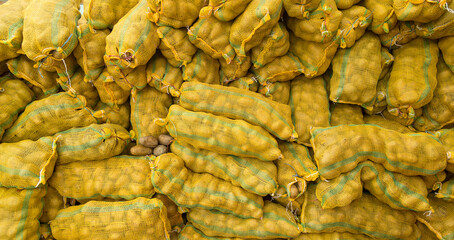 Fresh potatoes in bags, waiting for loading at the port of Singapore.