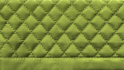 Fototapeta premium diamond stitching pattern, green quilted fabric texture background