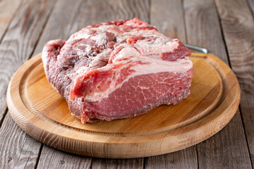 Fresh raw meat on an old table