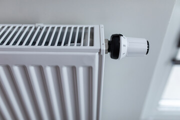 The battery is hanging on the wall. Heating in an apartment, at home. Heating prices.