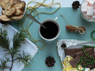 new year's flat lay. green background. top view photo. Christmas decorations, coffee. New year, Christmas, Valentine's day.
